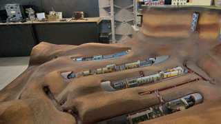 Illustration for article titled This Soviet Bunker Looks Like a Buried Alien Spaceship... with a Strip Club